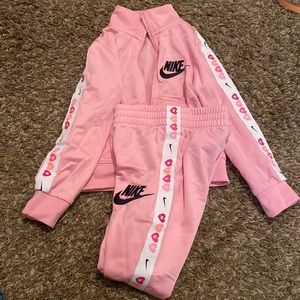 Pink Nike zip up and pant suit